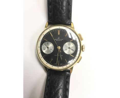 A Gents automatic vintage Breitling Top Time wristwatch, the black dial presenting baton numerals and two subsidiary dials, m