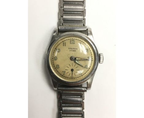 A vintage Eterna 17 jewel wristwatch with Arabic numerals and stainless steel loop strap.