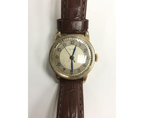 An unusual vintage gents Longines gold plated wristwatch with Arabic numerals, mounted on a later brown leather strap, appare
