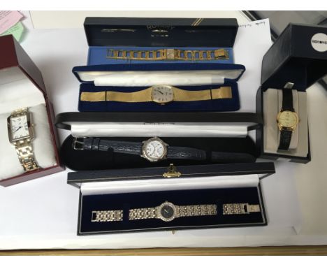 A collection of various ladies and gents watches in orgional boxes including a silver Herbert Brown watch Rotary Lotus and ot