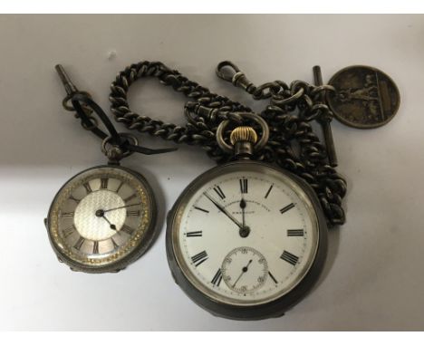 Two Silver pocket watches one button wind Lancashire Watch Co. and a small silver key wind watch. (2)