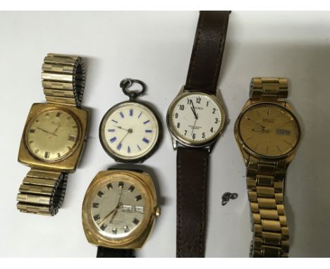 A collection of watches including a small silver continental key wind pocket watch a vintage Timex day date, Avia.