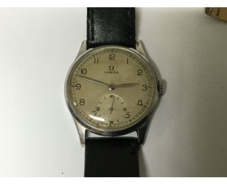 A Vintage Gents Crome cased manual wind Omega the dial with second subsidiary dial. Working order.