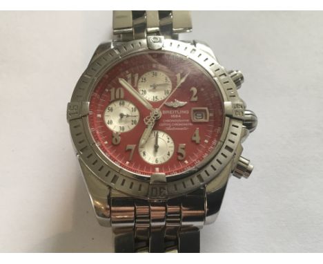 A Gents Breitling red dial Chronograph, Automatic.300m Stainless steel. With three silvered subsidiary dials. Working order s