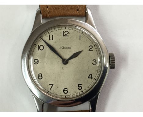 An interesting Military Le Coultre Watch with Arabic numerals on a light silvered dial in a stainless steel case the back pla