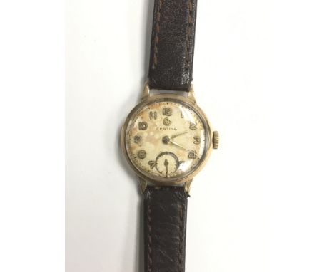 A boxed ladies 9ct gold vintage Certina wristwatch of petite size, presenting Arabic numerals and a subsidiary dial, mounted 