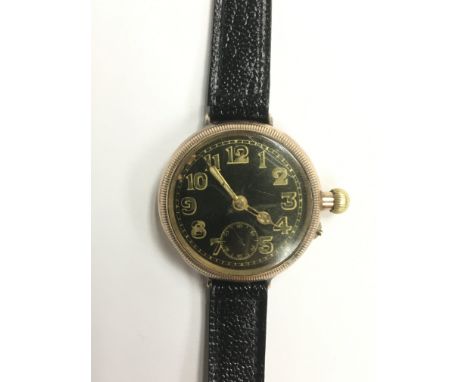 A vintage First World War issued gents wristwatch, possibly issued to an officer of the Royal Flying Corp, the black dial pre