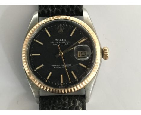 A Vintage Rolex Oyster Perpetual DateJust Superlative Chronometer, with a rose gold bezel black dial with raised battons, Gol