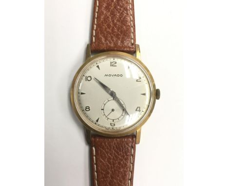 A boxed gents Movado manual wristwatch with alternating Arabic and baton numerals with subsidiary seconds dial, mounted on a 