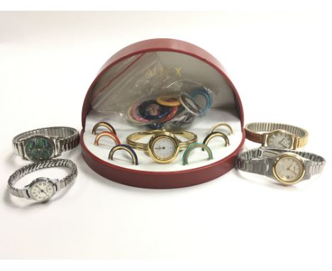 A boxed Aflex wristwatch with numerous and various interchangeable bezels alongside four other watches including Rotary and S