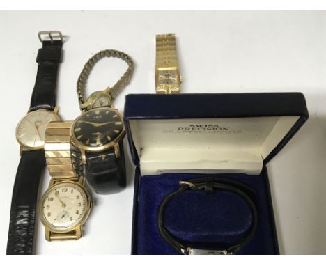 A collection of vintage watches comprising an Oris, with manual wind with black dial seen working. An Accurist Watch, manual 