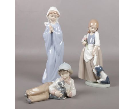 Three Nao by Lladro figures.  