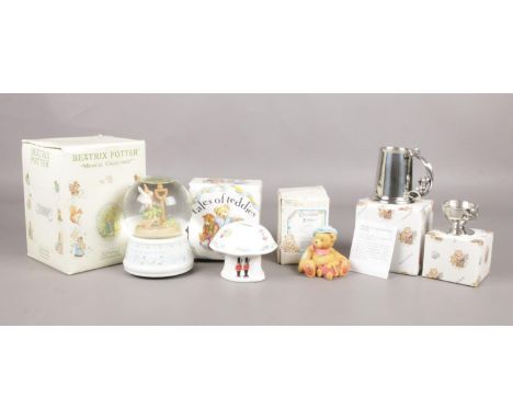 A selection of children's collectables. To include a boxed  Beatrix Potter musical snow globe (13.5cm), a boxed Royal Selango