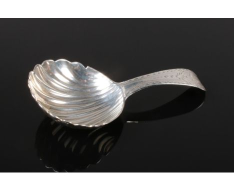 A George III silver caddy spoon. Assayed London 1788 by John Lambe. 11.65g.  