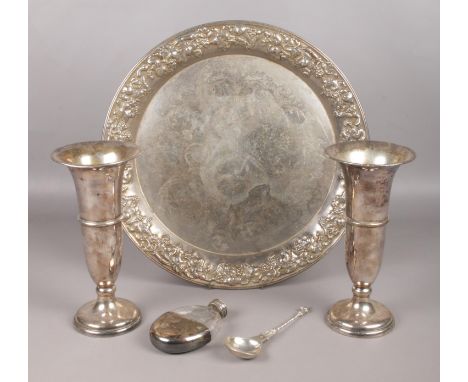 A small collection of white metal and silver plated items. To include a charger decorated with grapes and foliage, a pair of 