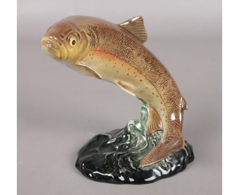 A ceramic Beswick figure of a leaping Trout. 1032.  Minor chips to some fins.