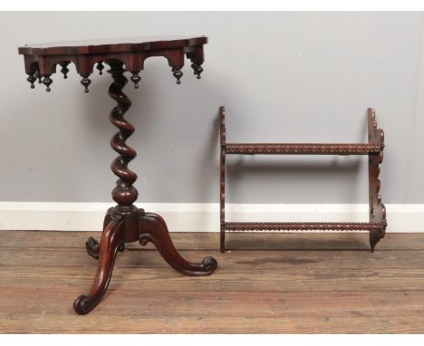 Two decorative turned and carved wooden pieces. To include a rosewood occasional table with scalloped top and barley twist pi