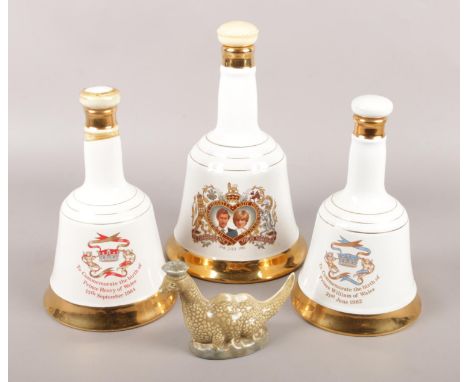 A collection of ceramic whisky decanters (all full and sealed). Includes three Wade Bell's commemorative examples and a Beswi