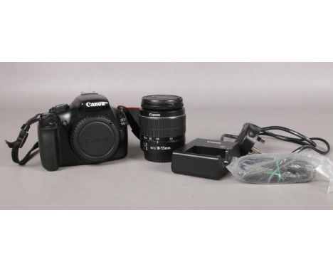 A Canon EOS 1100D digital SLR camera and accessories. To include a EFS18-55mm lens and battery charger etc.  Manual focus onl