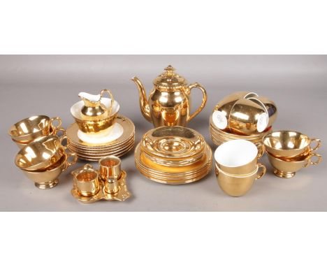 A collection of Royal Worcester and Royal Winton gilt teawares. Includes cruet, teapot, cups and saucers etc.  