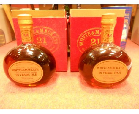 Whyte and Mackay 21 year old blended Scotch whisky, two 26 2/3fl.ozs bottles, probably 1970s; Niepoorts Porto 1976, one bottl