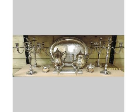 A silver plated tray, 61cm, together with a coffee set and two pairs of modern plated candelabra