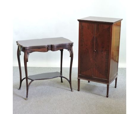 A 1920's mahogany music cabinet, 51cm, together with an Edwardian mahogany serpentine folding card table