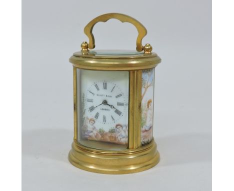 A continental brass cased carriage clock, with painted decoration, 12cm tall overall