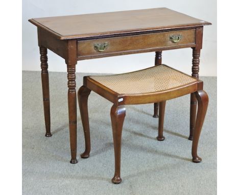 An Edwardian light oak side table, on turned legs, 89cm, together with a cane seated footstool