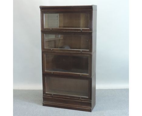 An early 20th century oak Globe Wernicke style four tier glazed bookcase, 83cm