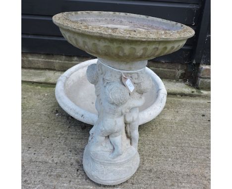 A reconstituted stone planter, 91cm, together with another, a bird bath, another and a large stone trough