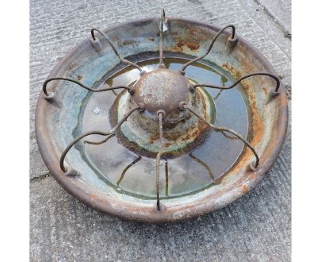 A large cast iron circular pig trough, 92cm diameter