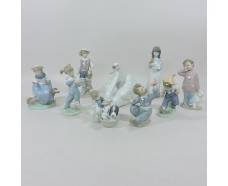 A Lladro model of a swan, together with eight Nao and Lladro figures, tallest 24cm