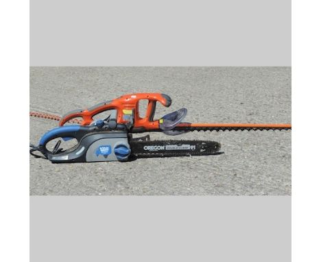An electric chainsaw, together with a Flymo hedge trimmer