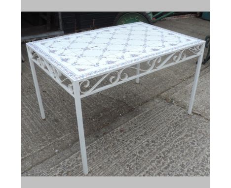 A white painted metal tile top table