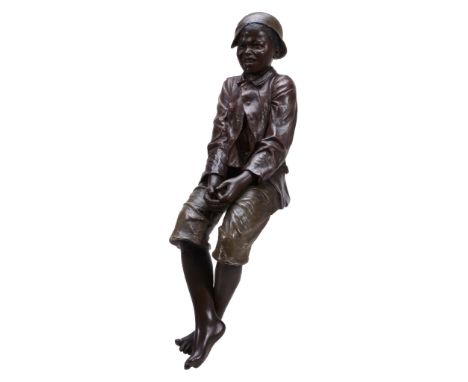 A Goldscheider cold-painted terracotta model of a seated boy, 20th century A Goldscheider cold-painted terracotta model of a 