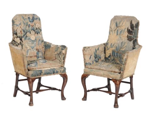 A pair of walnut and tapestry upholstered armchairs in George I style  A pair of walnut and tapestry upholstered armchairs in