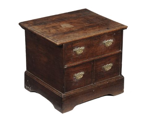 An oak box commode , early 18th century, the hinged lid opening to...  An oak box commode  , early 18th century, the hinged l