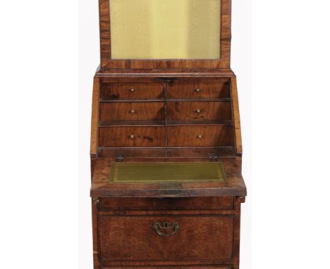 A George II walnut bureau bookcase of narrow proportions , circa 1740 and later  A George II walnut bureau bookcase of narrow