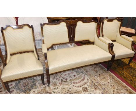 A late Victorian mahogany, satinwood and ivory inlaid three-piece parlour suite, comprising; two-seater sofa and lady's and g