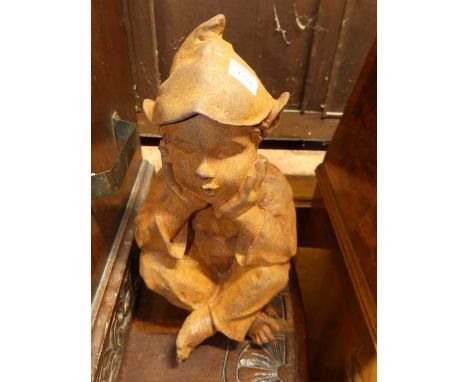 A contemporary rusted iron model of a seated pixie, h.33.5cm