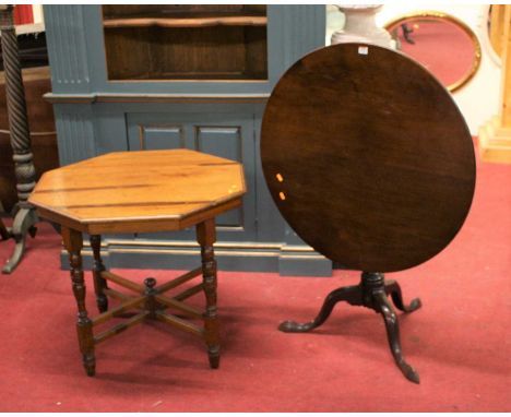 A George III mahogany circular tilt-top pedestal tripod table, raised on hipped supports, dia.84.5cm; together with an Edward