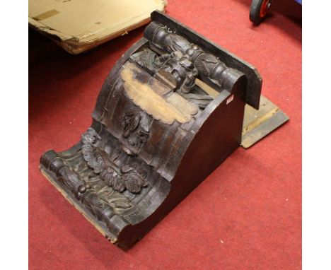 An early 20th century Continental heavily carved oak oversize wall bracket, w.48cmWith some losses to moulding.Split to top s