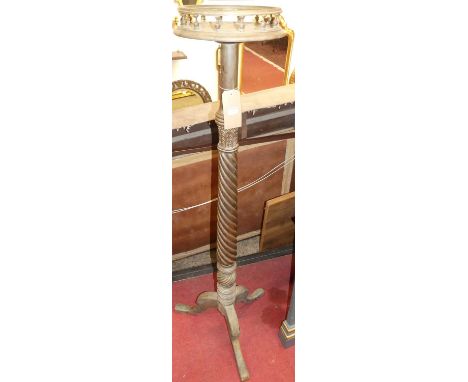 A hardwood spiral reeded and further ring-turned plant stand, having a galleried cylindrical top and on tripod supports, heig