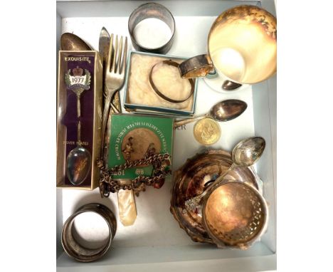 A group of silver and plated items, to include a silver charm bracelet suspended with charms including a Kermit the frog, a s