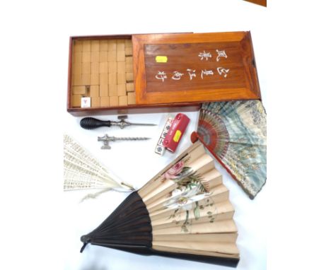 A Mahjong set and dice, together with a corkscrew, and three fans of various designs. (qty) 