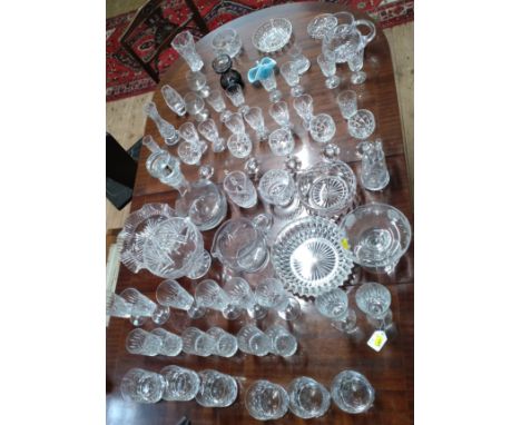 Sets of cut-glass wine glasses, sherry glasses, port glasses, tumblers, four jugs, seven bowls, a grey tinted vase 11cm and a