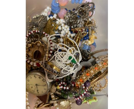 A collection of costume jewellery items, to include a yellow metal stick pin, a white metal novelty pin cushion in the form o