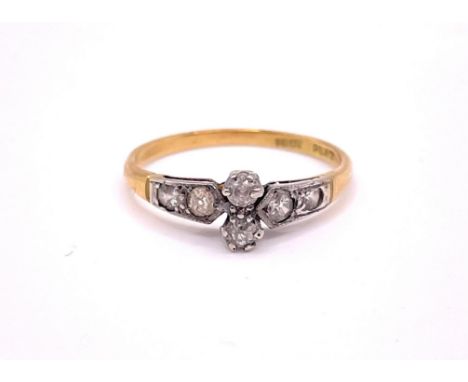 An early 20th century 18ct yellow gold and diamond ring, set with two old-cut diamonds, each shoulder set with two small diam