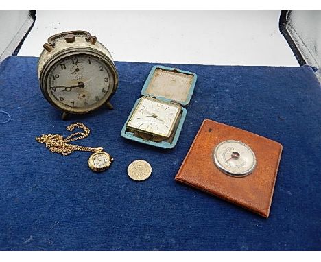 collection of alarm clocks, dress watches, barometer and a 1986 £2 coin